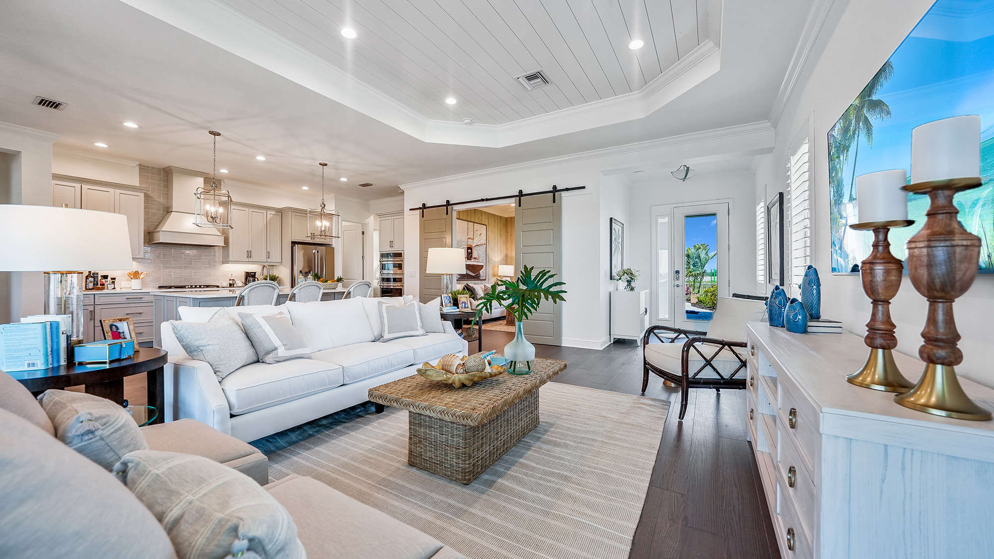 Living room, kitchen, and dining area at Sky Sail Bright Meadow by Neal Communities