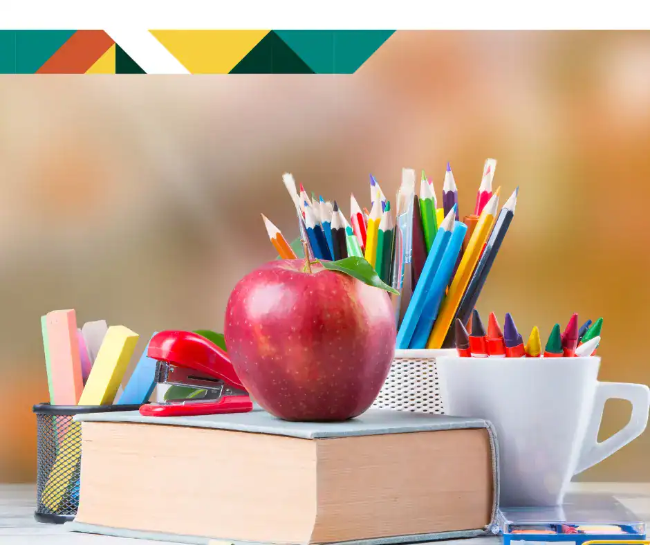 Image of apple, crayons, colored pencils, and textbooks